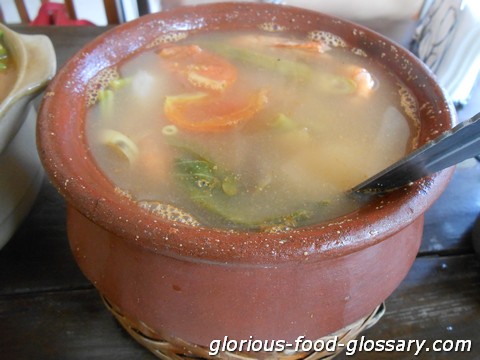 Sinigang na Hipon in a traditional pot made of clay called Palayok in the Philippines