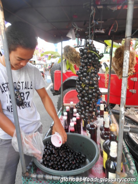 Fresh Lipoten and Lipoten made into a wine Lipoten - fresh and as wine sold in a festival in Liliw Laguna, Philippines